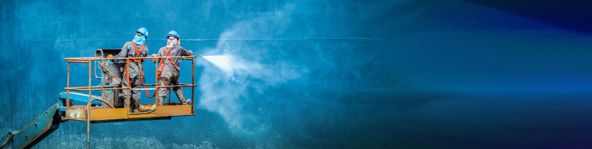 Banner of Two people washing cleaning at side shell ship, panorama Worker in floating dry dock with water jet cleaning have movement sea vegetation before sandblast and paint with copy space for tex.